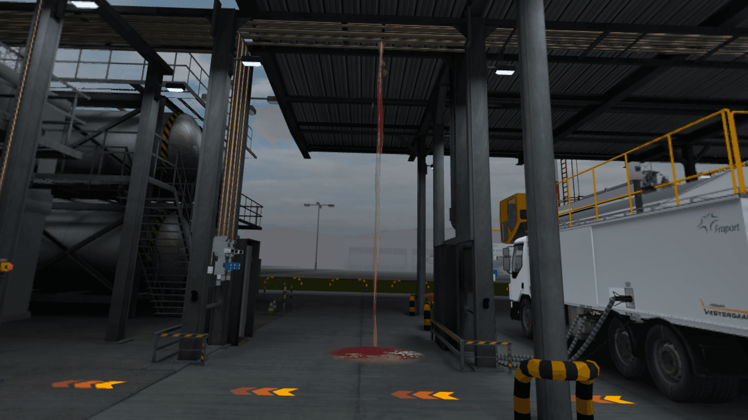 Du liquide de dégivrage s'écoule d'une canalisation aérienne et forme une flaque au sol sur la station de remplissage.