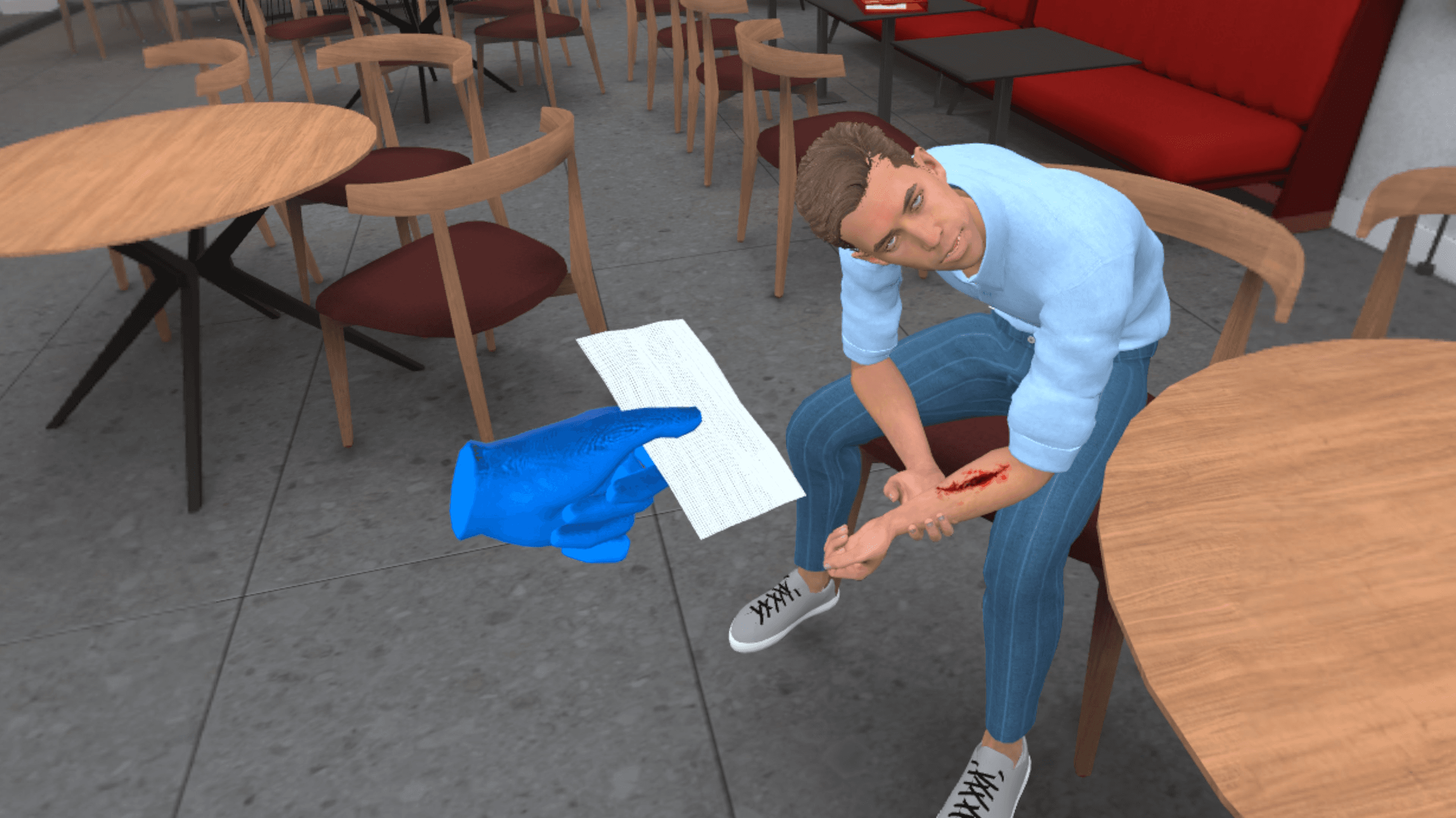 A blue-gloved hand offers a bandage to a passenger seated at an outdoor café table, tending to an injury on his leg.