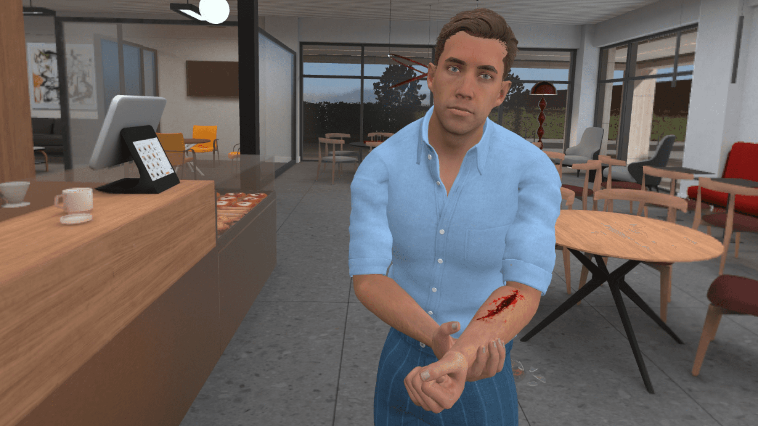 Un homme dans un bureau au style café montre une blessure au bras qui saigne, avant d'être soigné.